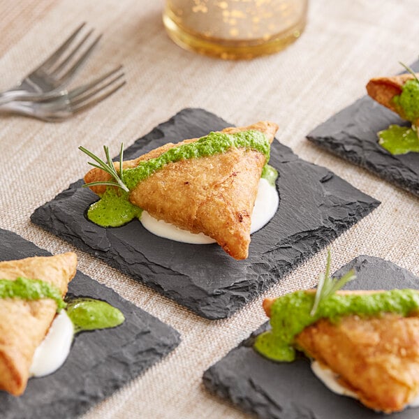 mini appetizer on a black appetizer plate