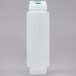 A white plastic bottle with a green cap.