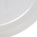 A clear plastic lid for a GET soup container on a white plate.