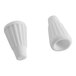 A close-up of a white plastic object with a white plastic nut.