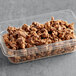 A clear container with REESE'S Peanut Butter Cups Chopped.