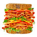 A sandwich with Prime Roots vegan Koji-ham, vegetables, and cheese.